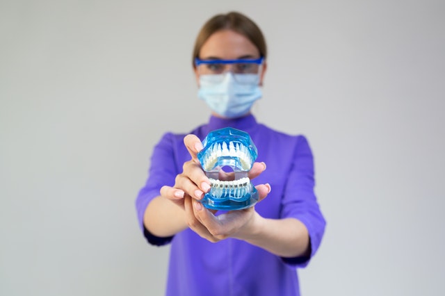 Illustrative example of cosmetic dental implants from Google Search